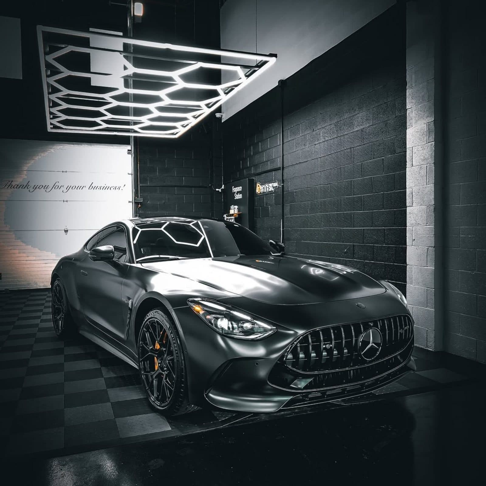 Black Mercedes-AMG GT finished in a detailing studio