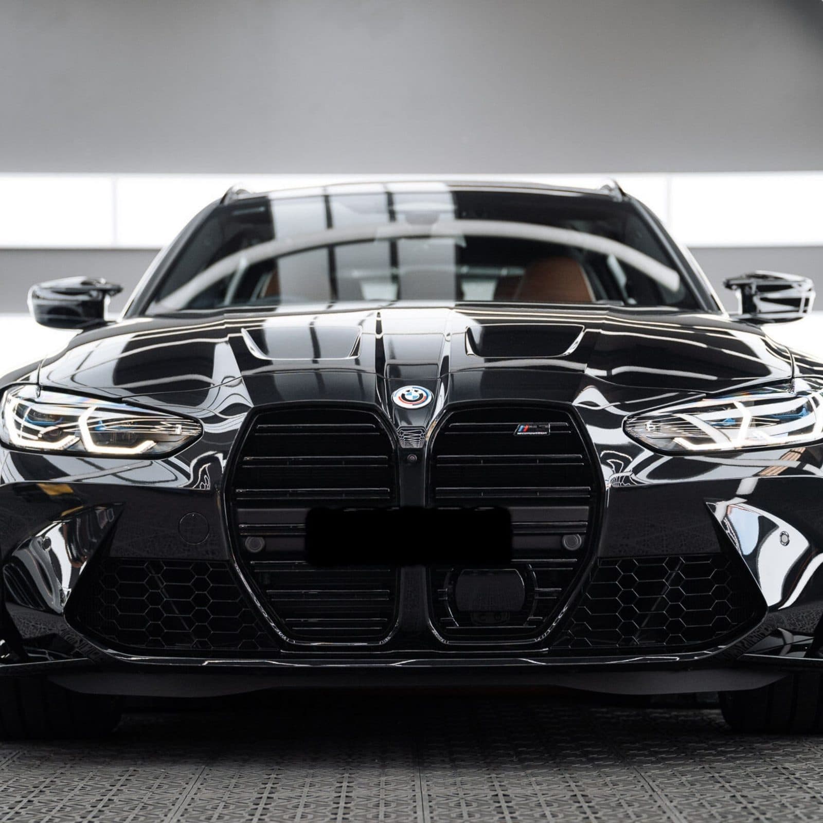 Front of a black BMW after a full detail