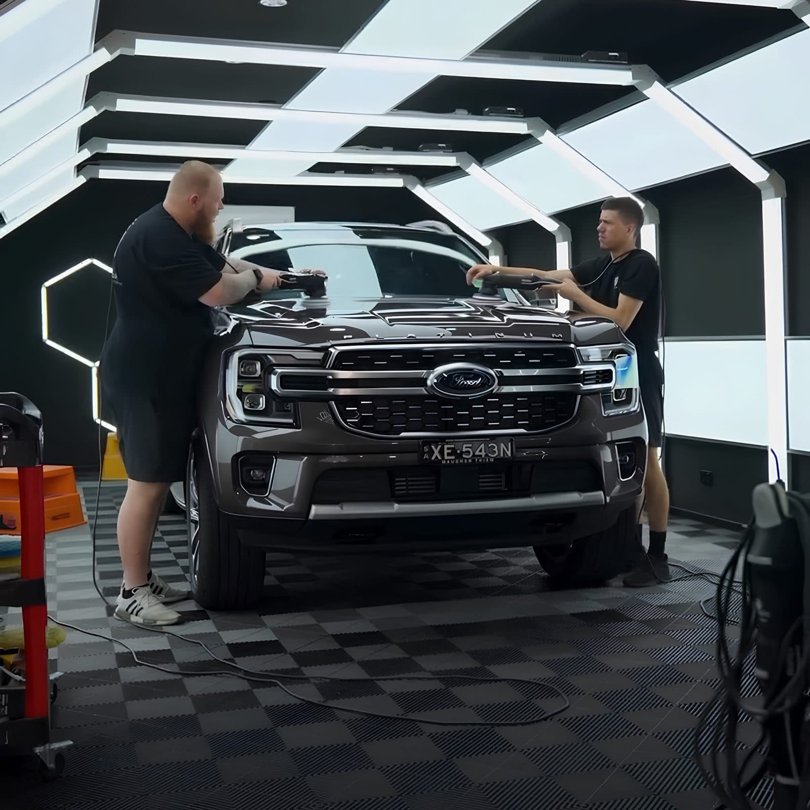 Machine polishing a bonnet during the correction stage, before any coating is applied