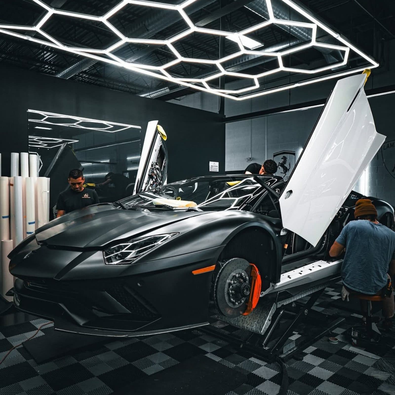 Black Lamborghini in a luxury detailing studio