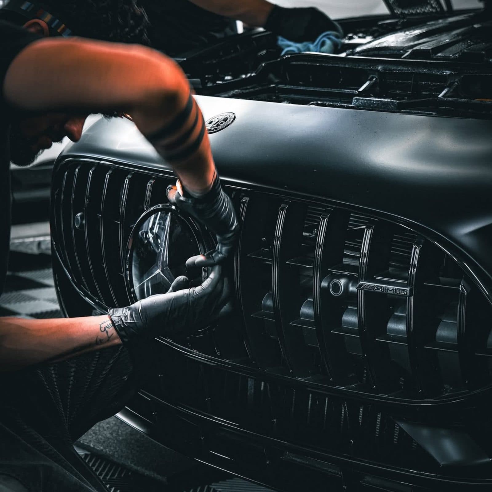 Close up of a Mercedes grille and paintwork after detailing